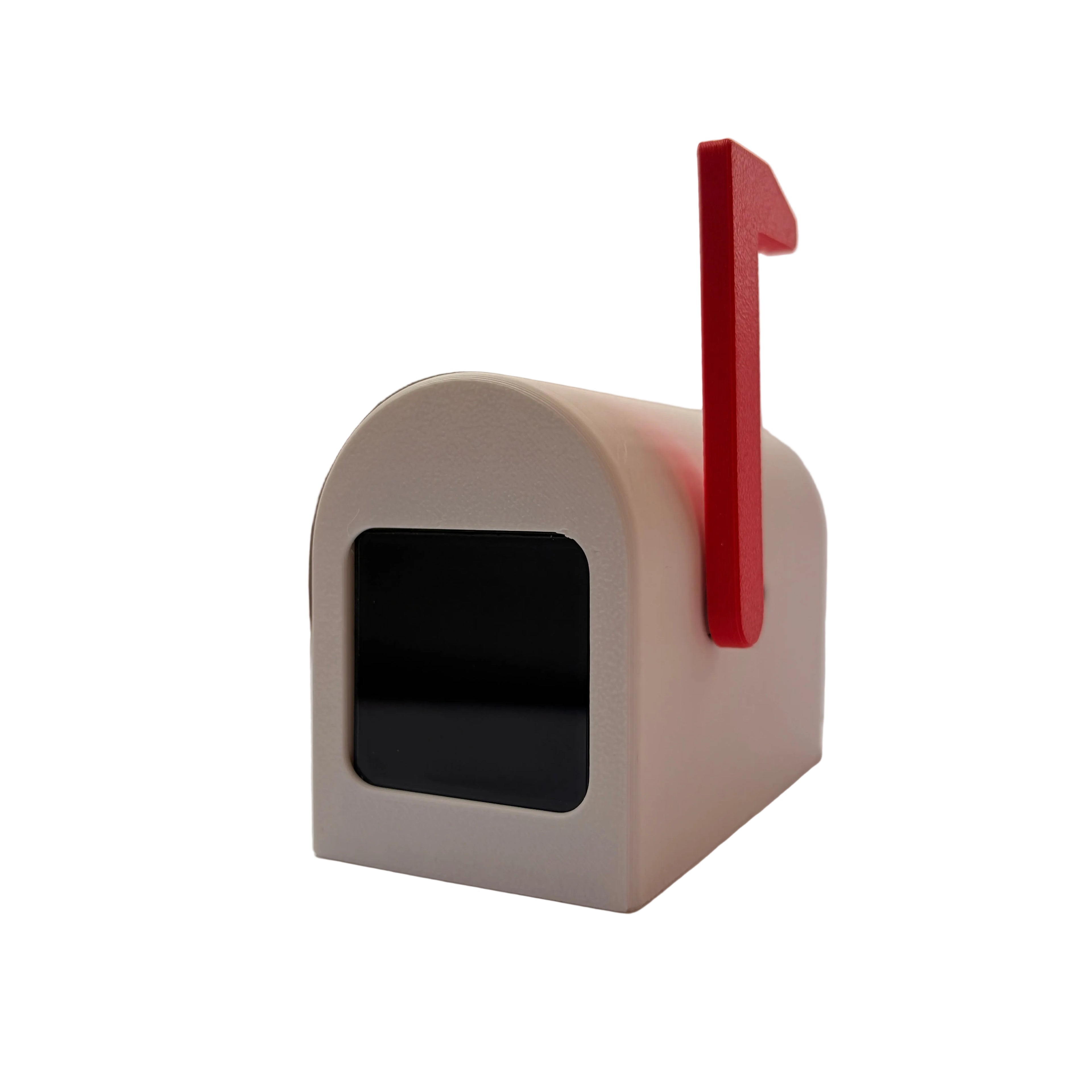 Small mailbox with a red flag on a white surface